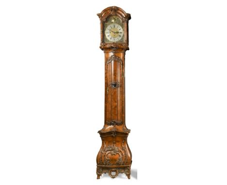 An 18th century German Rococo walnut longcase clock by Johann Rieppolt, Augsburg, [master 1727], the ornate carved case with 