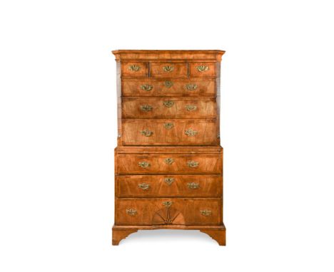 A George I walnut chest on chest, feather banded border decoration, the upper half with three short and three long drawers, f