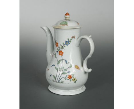 An early Worcester coffee pot and cover, circa 1755, decorated in the kakiemon style with foliage, 23cm high (2)  