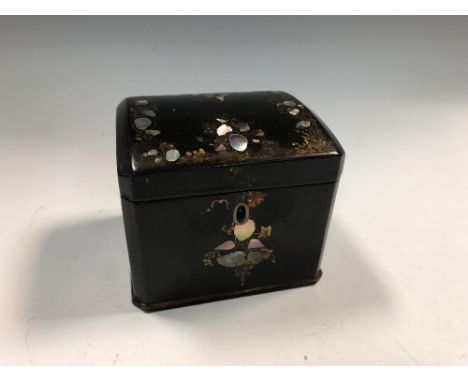 A 19th century papier maché tea caddy by Jennens &amp; Bettridge, of canted rectangular form inlaid with mother-of-pearl, sta