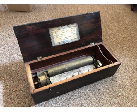 A small 19th century Swiss music box, the key wind 22.5cm cylinder mechanism numbered 8508 playing 4 airs, with original tune