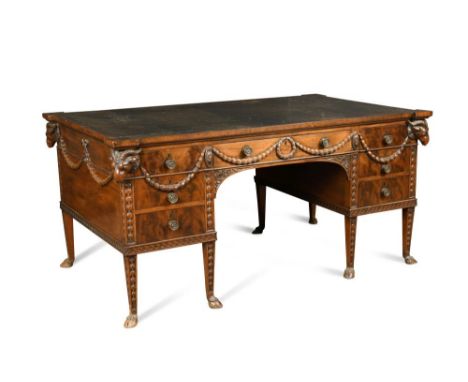 A late 19th century Adam revival mahogany partners desk, the eared top inset with a green leather panel and with seven small 