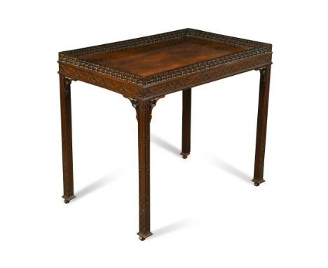 A George III and later mahogany 'Chinese Chippendale' design silver table, with pierced raised edge, on four chamfered moulde