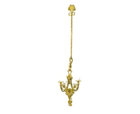 A set of four Louis XVI style ormolu three branch wall-lights, in the manner of Gouthiere, each backplate with musical trophy