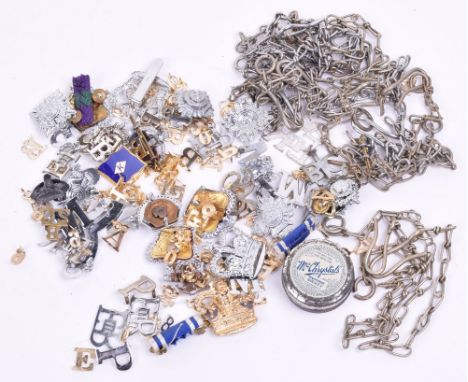 Eight chrome and white metal Police whistle chains, a quantity of officers pips, crowns, helmet plate centres/numbers, an int