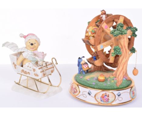 Winnie the Pooh Wind Up Ceramic Musical Ferris Wheel, in working order. Accompanied by a ceramic figure of Pooh in a sled. (2