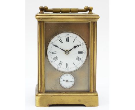 An early 20th century brass and four glass corniche cased striking carriage clock, the white enamelled dial with black Arabic