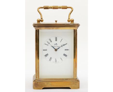 Matthew Norman, a 20th century brass and glass corniche cased striking repeater carriage clock, with swing handle, the white 