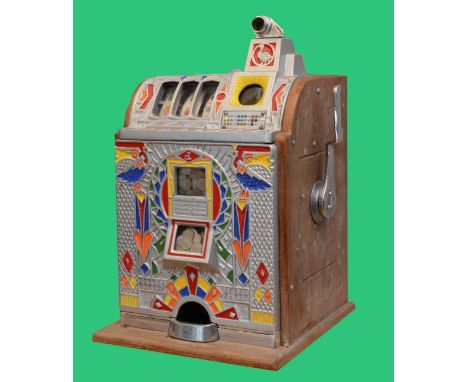 O.D. Jennings, a Peacock doble jackpot mechanical slot machine, c.1932, aluminium case, 62 x 38 x 37cm.No keys for the machin