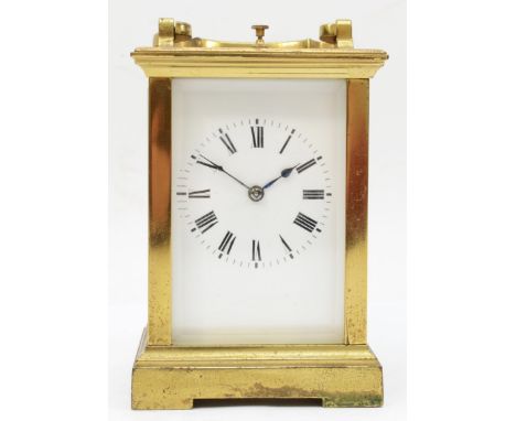 A 20th century French brass and four glass carriage clock, the white dial with black Roman numerals and carrying handle raise