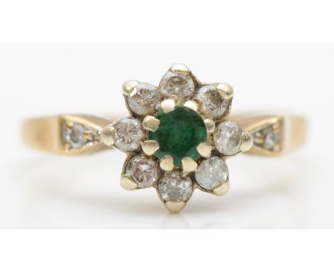 A vintage 9ct gold, emerald and brilliant cut diamond cluster ring, M, 2.3gm. 