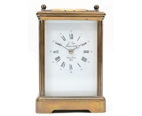A 20th century French brass corniche and four glass cased carriage clock, with swing handle, the white dial with black Arabic