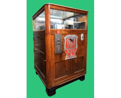 A Rotary Merchandiser, slot machine, by Exhibit Supply Co,. Chicago, c.1930, serial number 5433, varnished wood cabinet, 78 x