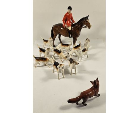 Beswick huntsman on horse figurine, together with ten hunting hounds and a fox, four dogs with restorations