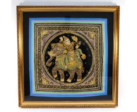 A 20th century Indian stump and beadwork panel, embroidered with a Goddess riding an elephant, framed, 59 x 59cm. 