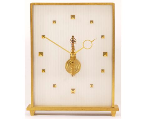 Jaeger le-Coutre, a mid 20th century brass and glass cased mantle clock, the dial with applied square shaped numerals, raised