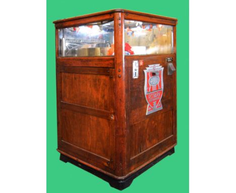 A Rotary Merchandiser slot machine, by Exhibit Supply Co. Chicago, c.1930, serial number 5481, varnished wood cabinet, 78 x 7