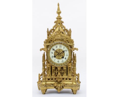 A late 19th/early 20th century gilt brass Architectural mantle clock, cast in the from of a Gothic style tower, the white cha