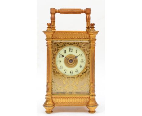 French Richard et Cie, a small 19th century  striking brass and four glass mantle clock, with swing handle, the engraved dial