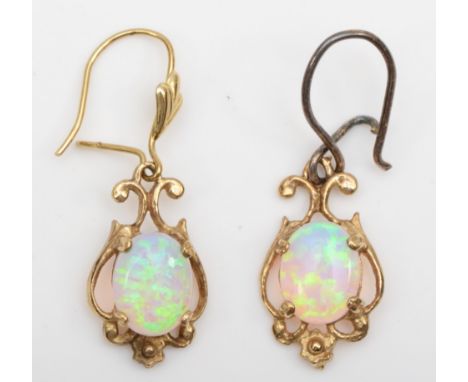 A pair of unmarked gold synthetic opal drop earrings, one with replaced silver post, 17mm,  2.2gm. 