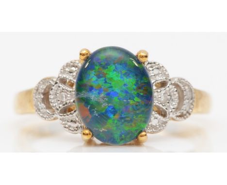 A 9ct black opal triplet dress ring, with eight cut diamonds set to the shoulders, Q, 3gm. 