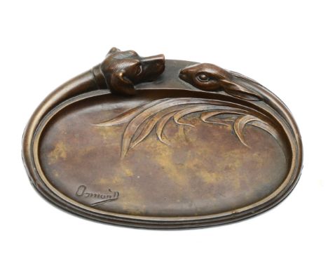 Maurice Osmond (1875-1951, French), a cast bronze oval pin dish, the outer rim cast with a dogs head and a hare, signed, 11.5