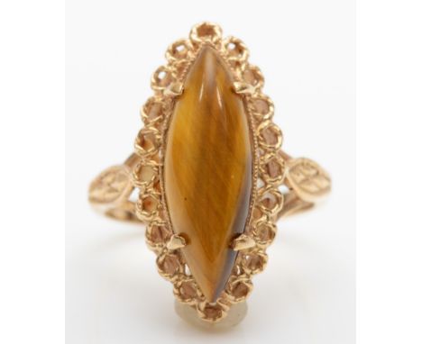 A vintage 9ct gold navette cut tiger's eye cocktail ring, with pierced gallery setting, O, 4.5gm. 