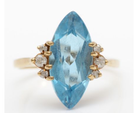 A 9ct gold marquise cut blue topaz and brilliant cut diamond cocktail ring, R, 3.8gm.Stone size 18 x 8mm, good overall condit