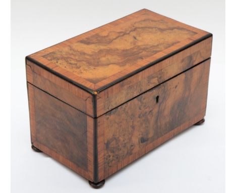 A 19th century burr walnut veneered twin division tea caddy, the hinged lid opening to reveal twin lidded sections, raised on