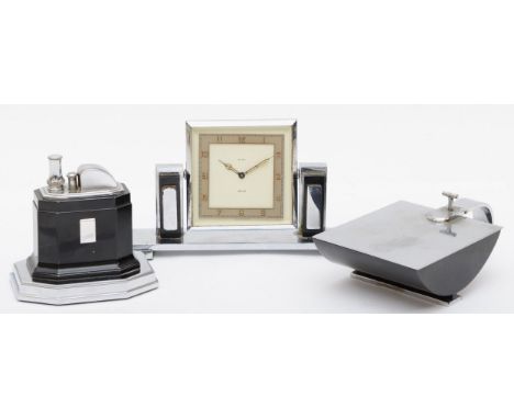 An Art Deco chrome plated desk set compring of a Smiths of London 8 day desk clock, the rotating dial with gilt painted Arabi