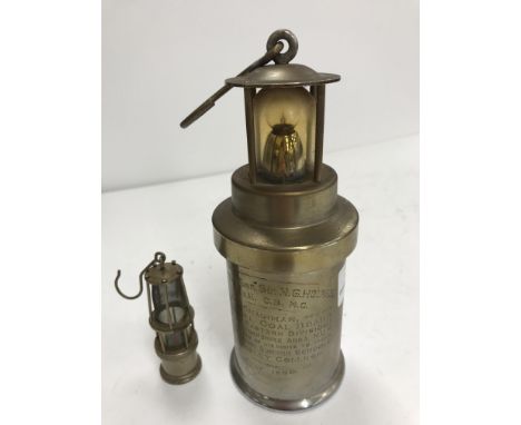 A table lamp as a miner's lamp inscribed to the base "The CEAG Miners Supply Co Ltd type BE3 Barnsley" with presentation insc