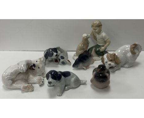 A collection of Copenhagen and other figurines to include a Copenhagen "Polar Bear cub", No'd 729, Copenhagen "Puppy group", 