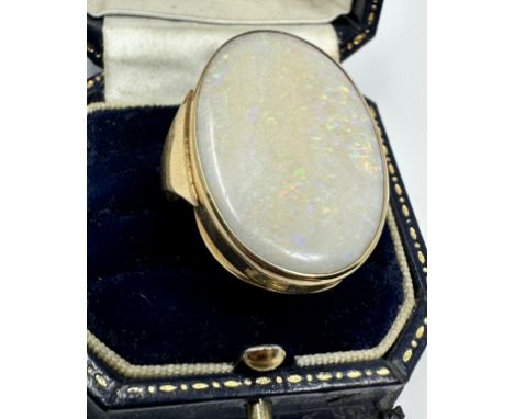 9ct gold ring set with very large opal that measures approx 31mm by 22mm weight of ring 10.5g 