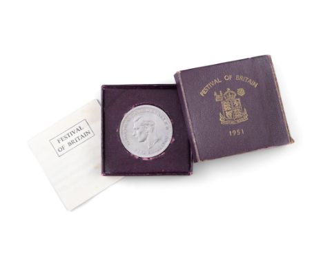 A COMMEMORATIVE 1951 FESTIVAL OF BRITIAN SILVER FIVE SHILLING COINin original box and with papers. 28.4 grams