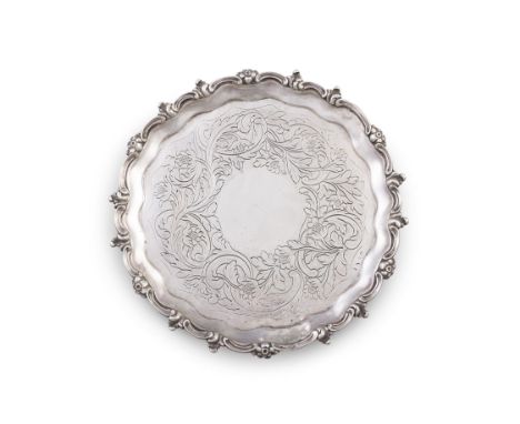 AN IRISH GEORGE III SILVER SALVERDublin 1813, lacking makers mark, of shaped circular form, with raised foliate and scroll ri