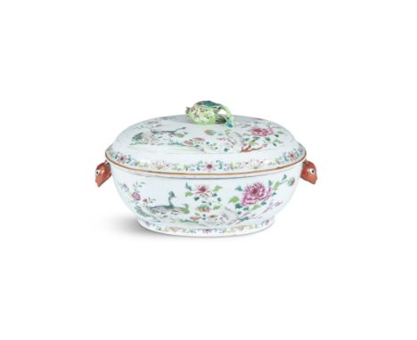 A CHINESE FAMILLE ROSE PORCELAIN SHAPED OVAL TUREEN AND LID, with pomegranate finial and twin animal mask handles, 34cm long 