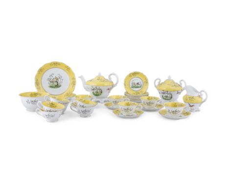 AN ENGLISH NINTEENTH CENTURY CHINA PART TEA SERVICE, the white ground decorated with exotic birds within a bright yellow bord