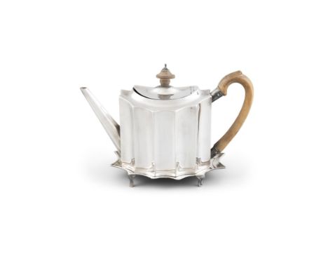 A GEORGE III SILVER TEAPOT AND MATCHING STAND, London 1792, makers mark of William Stroud, of lobed oval form, having timber 