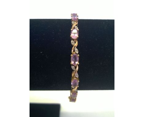 9ct gold bracelet set with amethyst & diamonds approx 8.1 total weight.