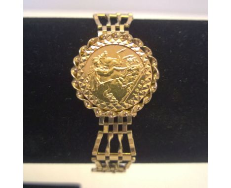 Gold half sovereign (1982) set in a 9ct mount and 4 bar gate bracelet with heart padlock clasp & safety chain.  Approx length