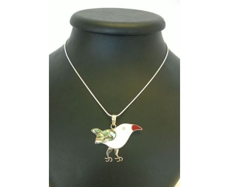 A bird pendant in Abalone Paua shell, Mother of Pearl shell, red coral, stamped 925 silver, on a rope chain