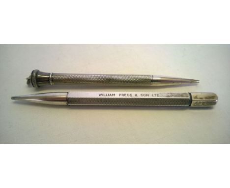 2 engine turned silver propelling pencils, one marked Sterling, the other London 1957. Maker JM&Co. (Johnson Matthey & Co)