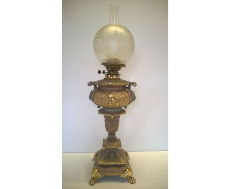 A very large ornate cast vintage iron oil lamp with decorative bird glass shade, two tone colouration added at a later date T