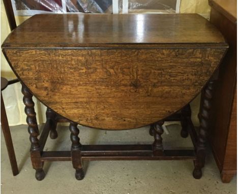 A Victorian oak gate leg table with barleytwist legs. 89 x 120cm open