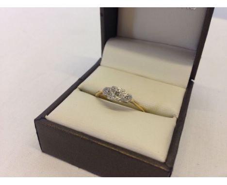 An 18ct gold & diamond trilogy ring. Diamonds set in a classic mount. Size R. Approx total weight 2.8g.