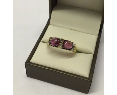 Victorian Betts & Fairfax 18ct gold ring set with 6 diamonds and 2 ruby cabochons Approx 5.5g. Size V. Birmingham 1881