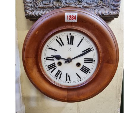 An antique German postman's alarm clock, 29.5cm diameter, with pendulum. 