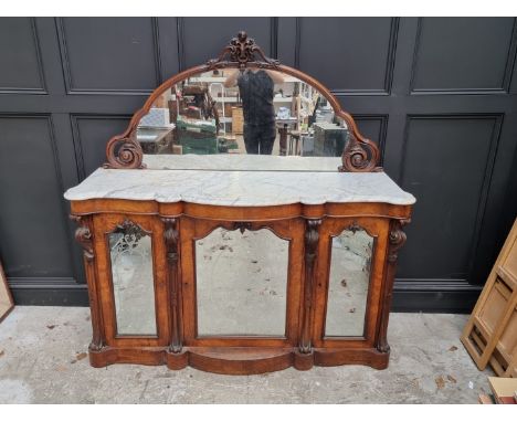 A Victorian walnut credenza, with mirror back and shaped marble top, 156cm wide. 