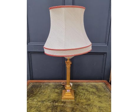 A gilt brass Corinthian column table lamp, (converted).&nbsp; 