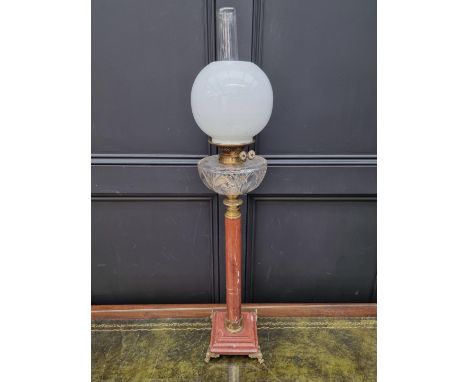 A red marble and brass mounted oil lamp, height excluding chimney 79.5cm.&nbsp;&nbsp; 